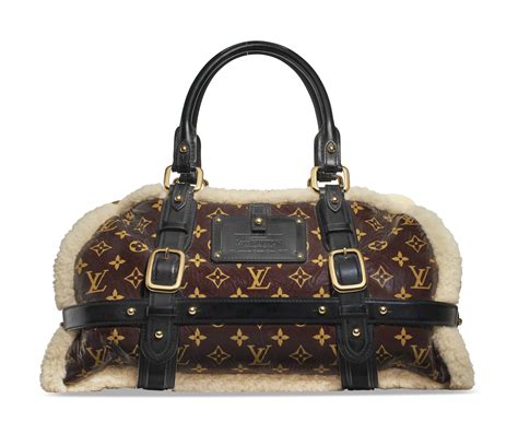 LOUIS VUITTON Monogram Shearling Storm Bag .